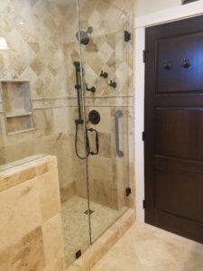 Bathroom 1 - Replaced the old tub/shower combo with a new travertine shower. Replaced all doors with solid wood and stained exactly as requested!