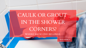 Walk-in shower with sealant in the inside corner and grout lines between gray tiles, tools nearby
