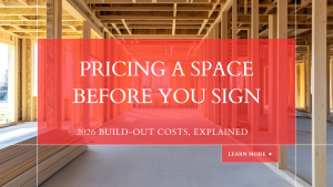 Empty retail storefront space with bare concrete floor and exposed ceiling before a build-out