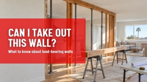 Opened interior wall with temporary shoring posts and a new beam during a load-bearing wall removal